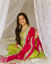 Vibrant lime green traditional outfit with pink and gold accents.