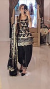 A Patiala-style salwar, known for its pleats and comfort, in matching black fabric with subtle embellishments