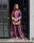 Majestic Aura: Woman in Purple Captivates at the Doorway