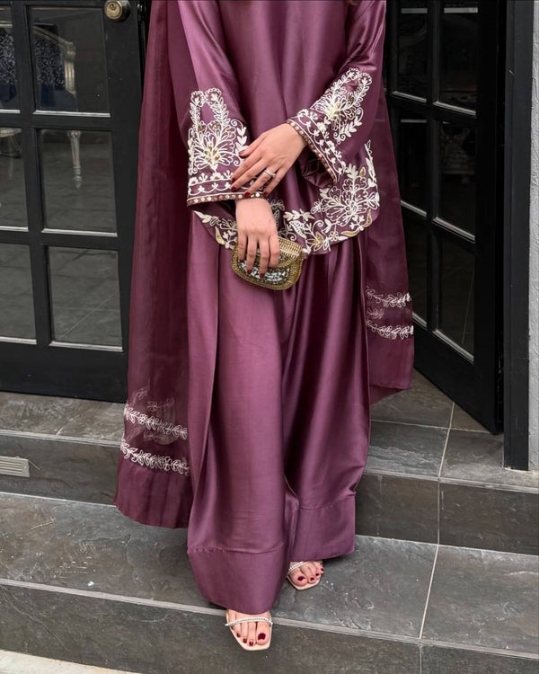 Majestic Aura: Woman in Purple Captivates at the Doorway