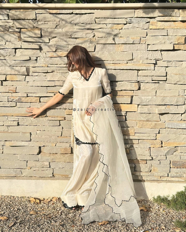 The Essence of Sophistication: A Woman in a Striking White Suit Portrait