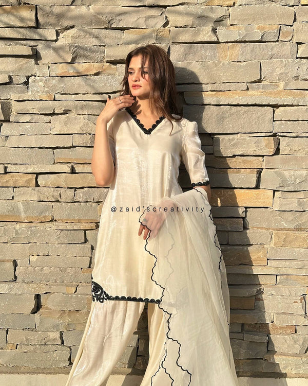 The Essence of Sophistication: A Woman in a Striking White Suit Portrait