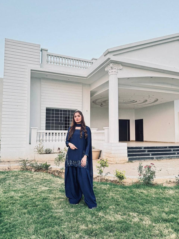 Elegant Harmony: The Blue Suited Muse Embracing Nature's Serenity in a Chic Urban Oasis