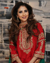 Radiant Red Embroidered Festive Outfit with Gold Detailing and Jewelry